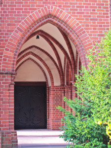 Series of arches leading to a door to the interior - focus on self-examination